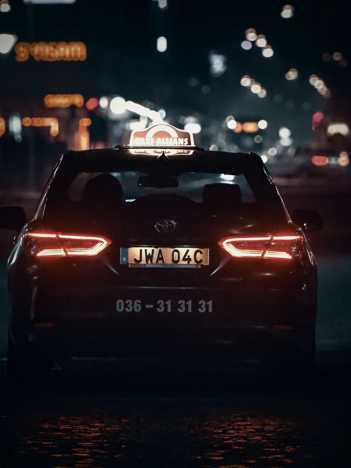 A car on the move at night — the chauffeur-driven car sharing Yodo Mobility runs.